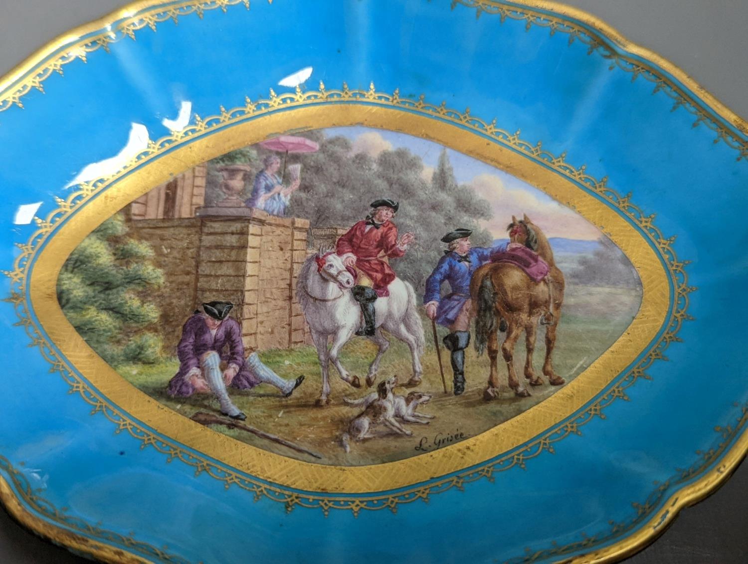 A 19th century Sevres oval shaped dish painted with a hunt scene, with three gentlemen, two dogs two - Image 2 of 3