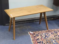 In the style of Pierre Jeanneret. A rectangular teak occasional table on compass leg, width 84cm,