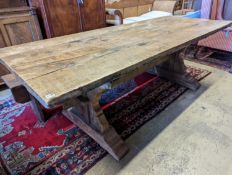 An 18th century style oak refectory dining table with planked top, length 228cm, depth 96cm,
