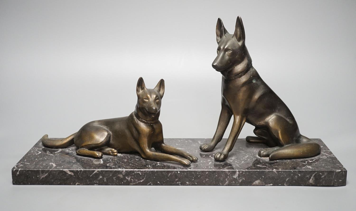 An Art Deco patinated spelter German Shepherd group, 40cm