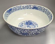 A large 19th century Chinese blue and white ‘dragon’ bowl (a.f.) 41cm