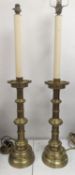 A pair of Gothic style brass table lamps, height 79cm