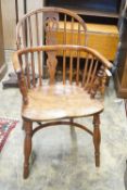 A near pair of mid 19th century Nottingham Area yew and elm Windsor elbow chairs with crinoline