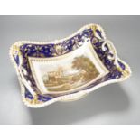 A Derby two handled pedestal dish with a named view of Sterling Castle, under a blue and gilt border