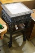 A Chinese carved hardwood two tier jardiniere stand with rouge marble top, width 43cm, depth 43cm,