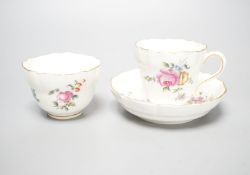 A Chelsea-Derby coffee cup, tea bowl and saucer painted with sprays and sprigs of flowers, c.1775,