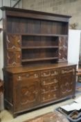 An 18th century oak dresser, length 180cm, depth 50cm, height 212cm