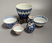 A Chinese blue and white bowl on stand, two tea bowls, miniature vase and an enamelled bowl, 18th-