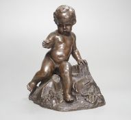 A bronze of a seated boy, height 17cm