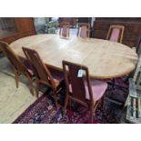 A set of six Niels Koefoed teak dining chairs and circular Danish teak dining table, 220cm extended,