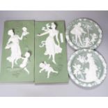 A collection of Limoges-type bisque plaques, largest 25.5 cm