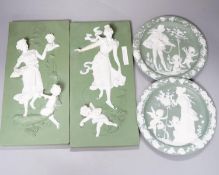 A collection of Limoges-type bisque plaques, largest 25.5 cm