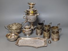 A set of six Persian embossed 84 standard white metal coffee cup holders and matching sugar bowl and