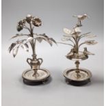 Tw South American? white metal toothpick holders?, modelled as a floral displays with circular