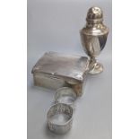 A silver cigarette case, four silver napkin rings, a cased part German 835 standard mirror and brush