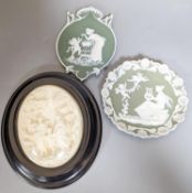 A collection of French bisque plaques, largest 24.5cm and two faux ivory reliefs