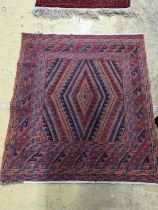 A geometric flatweave rug, 130 x 117cm