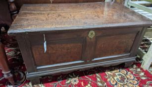 An 18th century panelled oak coffer, length 98cm, depth 54cm, height 59cm