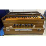 A hardwood cased harmonium