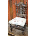 A Carolean style carved oak child's chair, height 70cm