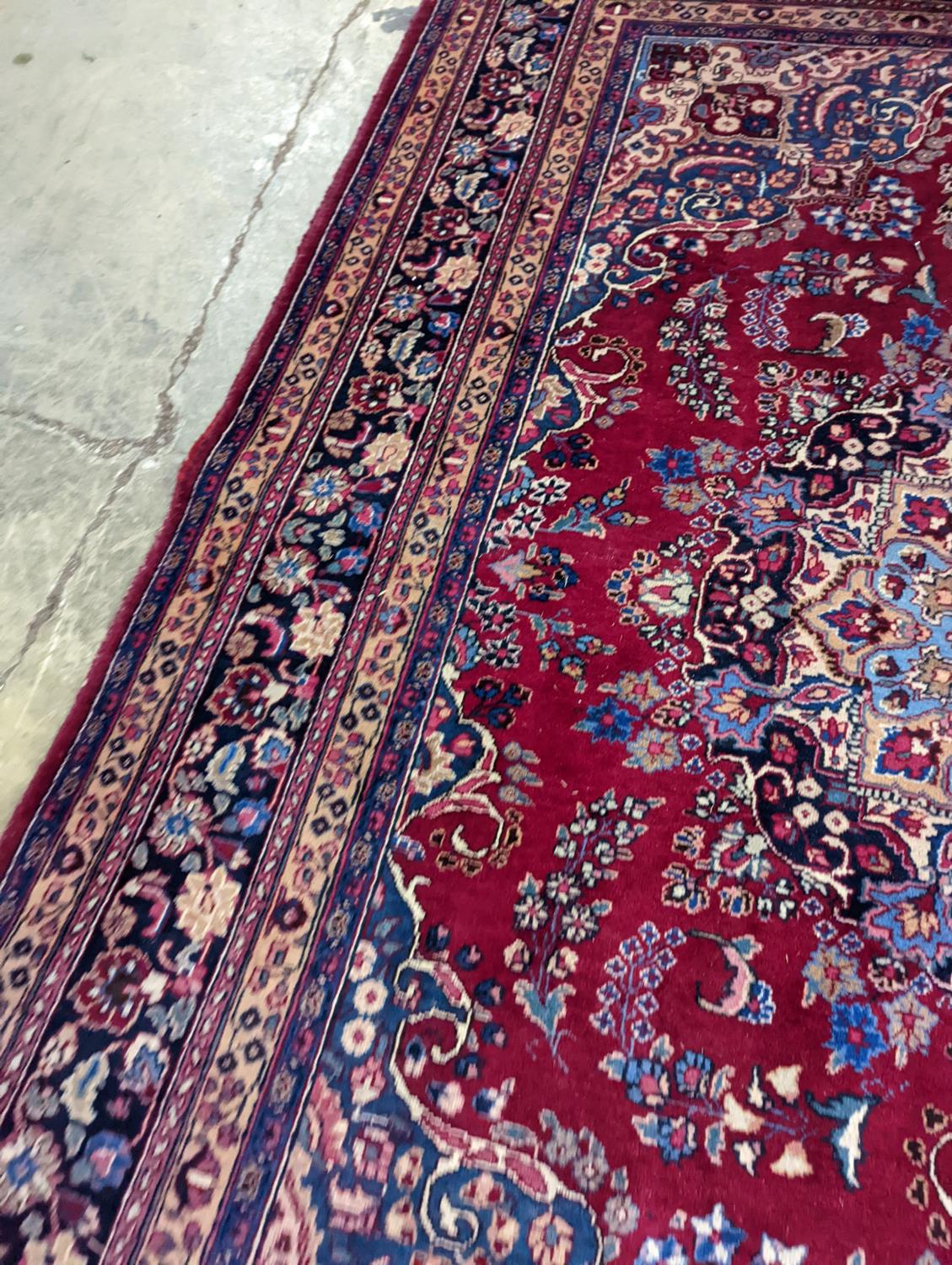 A Tabriz burgundy ground carpet, 350 x 250cm - Image 3 of 4