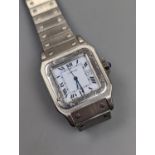 A gentleman's stainless steel Cartier Santos automatic wristwatch, on a stainless steel Cartier