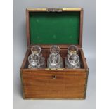 A brass bound mahogany six bottle decanter box, containing 6 cut glass decanters