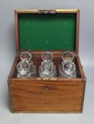 A brass bound mahogany six bottle decanter box, containing 6 cut glass decanters