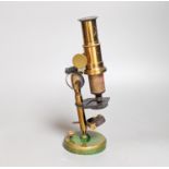 A mahogany cased brass compound microscope