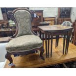 A Victorian walnut nursing chair together with a reproduction nest of tea tables