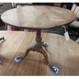 A George III circular oak tilt top tea table, diameter 74cm, height 66cm