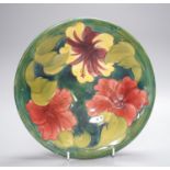 A Moorcroft hibiscus pattern dish 25cm