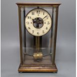 A Maurice Favre - Boulle electric pendulum clock, in a brass and mahogany four glass case, back-