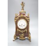 A 19th century French tortoiseshell and gilt metal mounted clock with key and pendulum 40cm