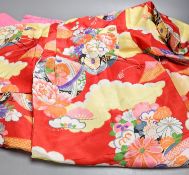 A multi-coloured silk kimono, a floral kimono and a child's silk kimono