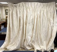 A large pair of cream silk curtains. 100 inches drop