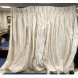 A large pair of cream silk curtains. 100 inches drop