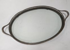 A silver plated and glass gallery tray 77cm