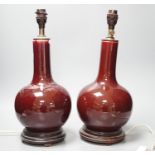 A pair of Chinese sang de boeuf glazed vases, converted to table lamps (a.f.)