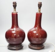 A pair of Chinese sang de boeuf glazed vases, converted to table lamps (a.f.)