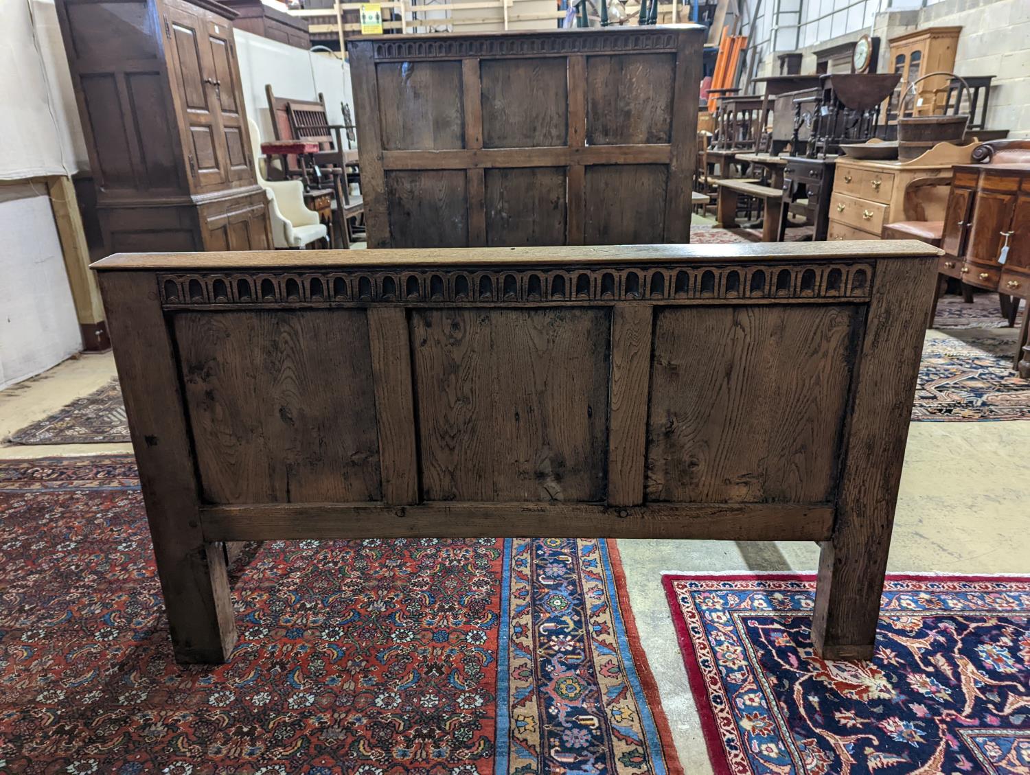 A 17th century style panelled oak bedstead, width 143cm, length 204cm, height 140cm - Image 2 of 3