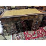 A reproduction mahogany pedestal desk, length 138cm, depth 69cm, height 79cm