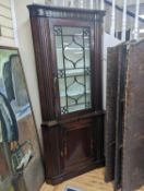 A Regency brass inlaid banded mahogany standing corner cabinet, width 96cm, depth 50cm, height
