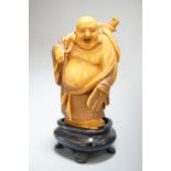 A Japanese stained Ivory figure of Hotei, early 20th century, 7.2cm