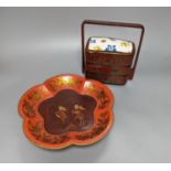 An Oriental lacquer 3 tier picnic box and similar dish, 26cm