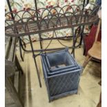 A Victorian style wrought iron pot stand, width 110cm, height 95cm, together with a graduated set of