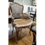 A 19th century French carved and caned walnut salon chair, width 52cm, depth 46cm, height 87cm