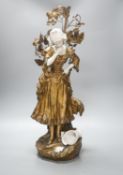 A late 19th Century French gilt spelter and bisque porcelain figure after Mednat 54cm