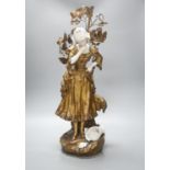 A late 19th Century French gilt spelter and bisque porcelain figure after Mednat 54cm