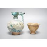 A Kashan turquoise glazed pottery ewer, 14th century, with mineral iridescence and an early